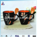 flower handpainted ceramic cup with spoon and black rim